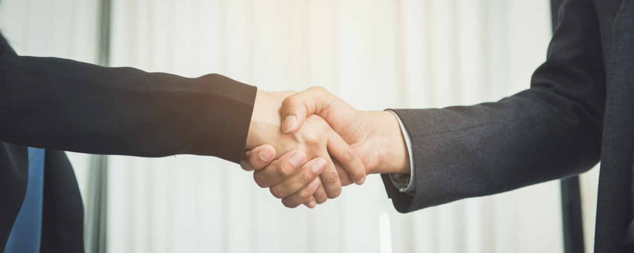 Negotiating business,Image businesswomen handshake,happy with wo
